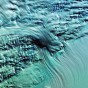 Geleira Lambert - Um vasto lençol de neve antártica se desloca sobre a maior geleira do mundo, com 400 quilômetros de extensão