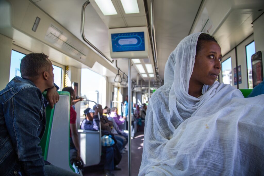 Addis Ababa is one of 10 recipients to receive the prestigious C40 Cities Awards 2016 as global recognition for cities that are demonstrating climate action leadership. A lady holding her baby wrapped in a white shawl is transported on an Addis Ababa rail line tram. The electric powered rail line is 34 km long and was inaugurated in September 2015 with the hope that it would give the citys residents a clean, fast mode of transportation. Despite the Ethiopian government building a network of roads across Addis Ababa, its roads are jammed with traffic causing misery for commuters and drivers alike. (Mulugeta Ayene/AP Images for C40)